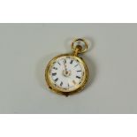 AN 18K YELLOW GOLD LADIES FOB WATCHES open-faced with stem wind, the dial with Roman numerals and