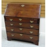 NINETEENTH CENTURY MAHOGANY BUREAU with sloped front and four graduated drawers all with brass