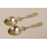 A PAIR OF SILVER SPOONS with twist stems and angel terminals, marks for Nathan & Hayes, Birmingham