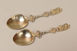 A PAIR OF SILVER SPOONS with twist stems and angel terminals, marks for Nathan & Hayes, Birmingham