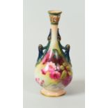 A SMALL ROYAL WORCESTER VASE with narrow pierced necked and twin-handles, painted with wild-flowers,