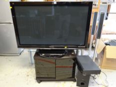 A Panasonic Viera 46-inch flatscreen television on stand together with a DVD player and speaker