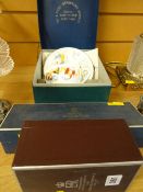 A boxed Royal Worcester cup and saucer, a boxed commemorative goblet and a boxed Royal Worcester