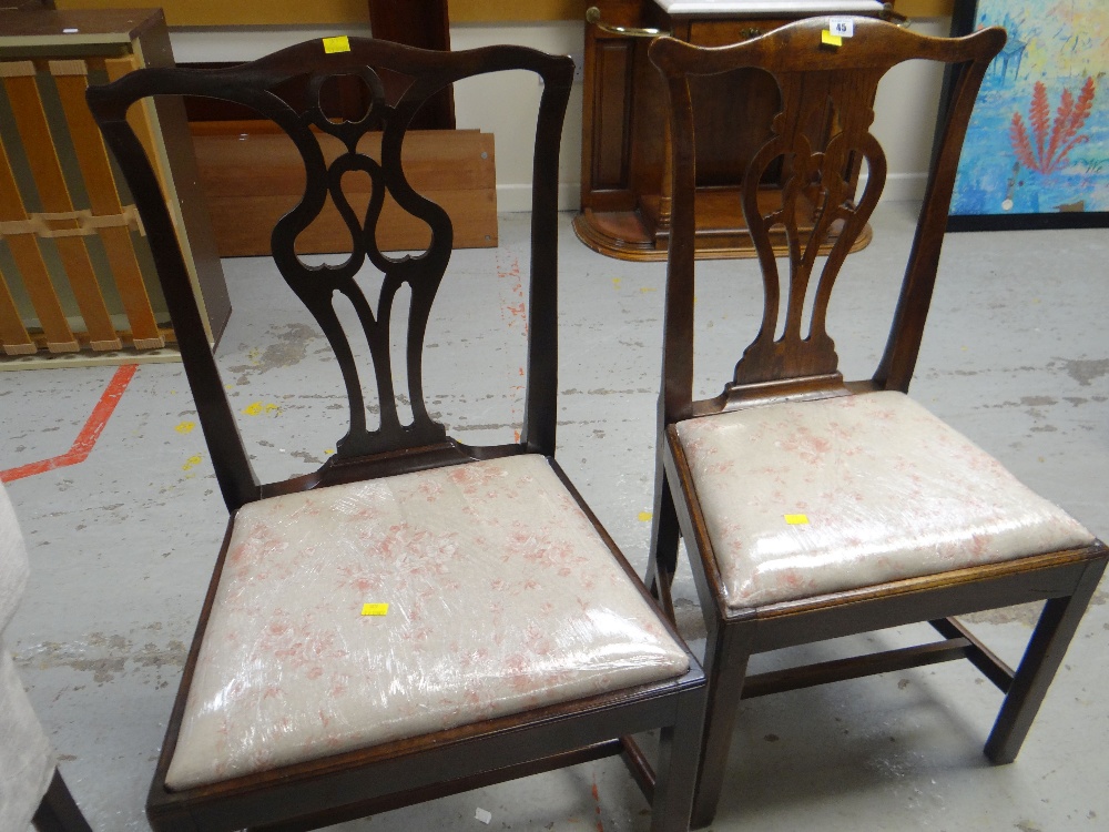 A pair of Chippendale-style chairs with drop in seats