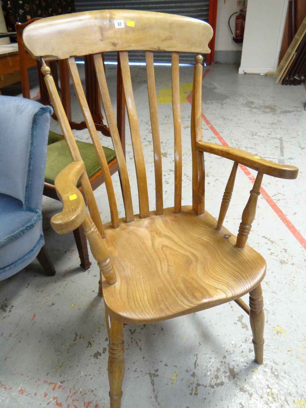 A lightwood Windsor elbow chair