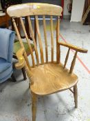 A lightwood Windsor elbow chair