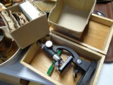 A boxed laboratory microscope together with slides