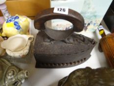 A vintage flat iron with coal box