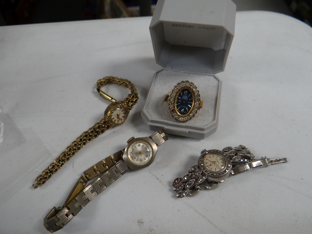 Four ladies' watches comprising a fancy 'ring' watch, a marcasite cocktail watch and two vintage