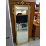 A modern ornate gilt framed hall mirror together with a small circular gilt framed mirror