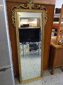 A modern ornate gilt framed hall mirror together with a small circular gilt framed mirror