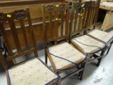 A set of four vintage dining chairs with Art Nouveau carving