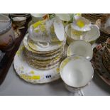 A quantity of Staffordshire yellow floral tea ware