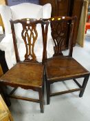 A pair of Chippendale wooden seated farmhouse-type chairs