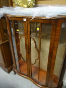 A vintage polished two-door china cabinet