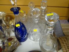 Six glass decanters including plain glass and hobnail cut square base decanters