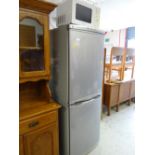 An LG Express Cool upright fridge freezer in grey together with a Matsui microwave oven