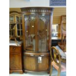 A good quality Bevan Funnell 'Reprodux' furniture bow front standing corner cupboard and cabinet