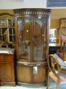 A good quality Bevan Funnell 'Reprodux' furniture bow front standing corner cupboard and cabinet