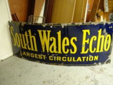 An early twentieth century enamel on metal advertising sign 'South Wales Echo - Largest