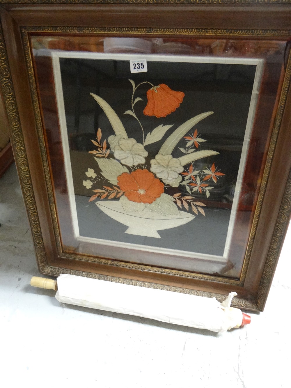 A parasol and a good quality embroidery in a frame