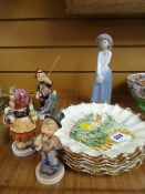 Six E J Bodley dishes, three German pottery figures and a Nao figurine