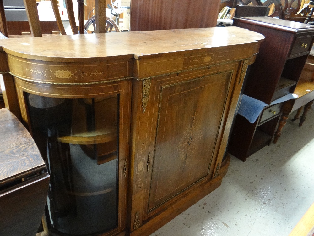 A late Victorian walnut credenza with curved glass side cabinets and centre single door cabinet