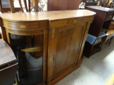 A late Victorian walnut credenza with curved glass side cabinets and centre single door cabinet