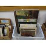 A box of framed pictures