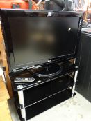 An LG 32-inch flatscreen TV in black on matching stand