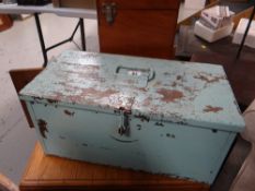 A painted metal toolbox and contents