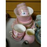 A quantity of vintage pink & gilded tea ware