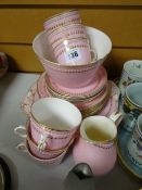 A quantity of vintage pink & gilded tea ware