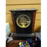 A good slate & marble French mantel clock with circular dial & Roman numerals
