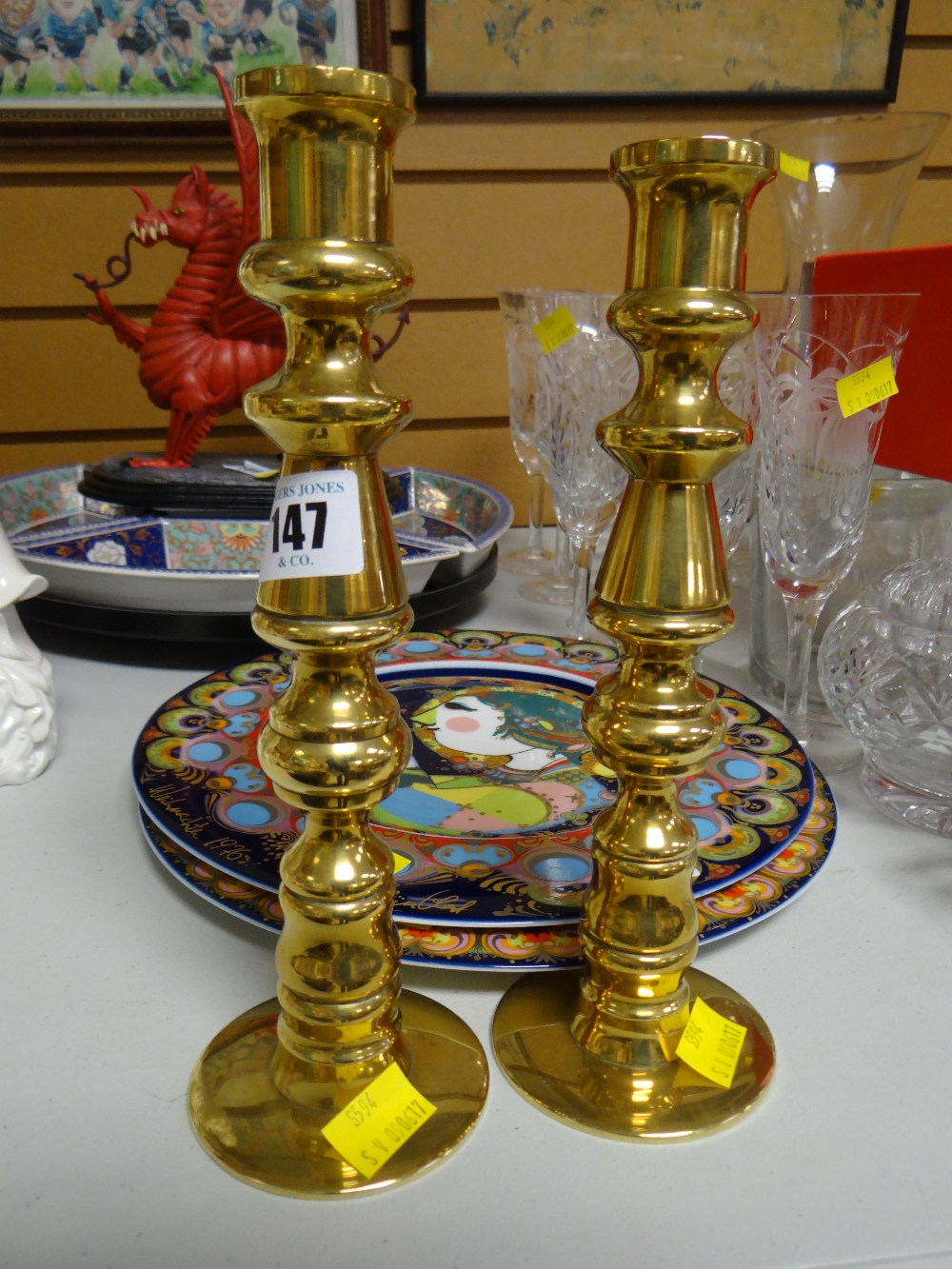 A pair of unusual heavy brass candlestick holders