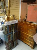 A modern pseudo book-library bookcase, a gilded console table and a yew television cabinet with