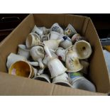 A box of pottery bells etc