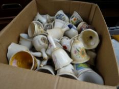 A box of pottery bells etc