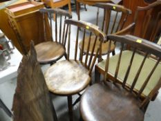 Set of four circular seated wooden chairs together with an antique elbow chair