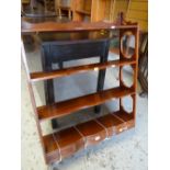 A Bevan Funnell 'Reprodux' mahogany four shelved wall rack with three drawers