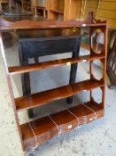 A Bevan Funnell 'Reprodux' mahogany four shelved wall rack with three drawers