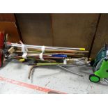 A quantity of garden tools and brushes etc