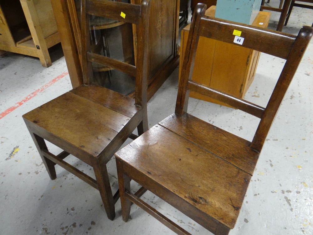 A pair of farmhouse chairs