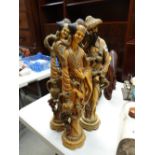 Three Oriental-type resin figures
