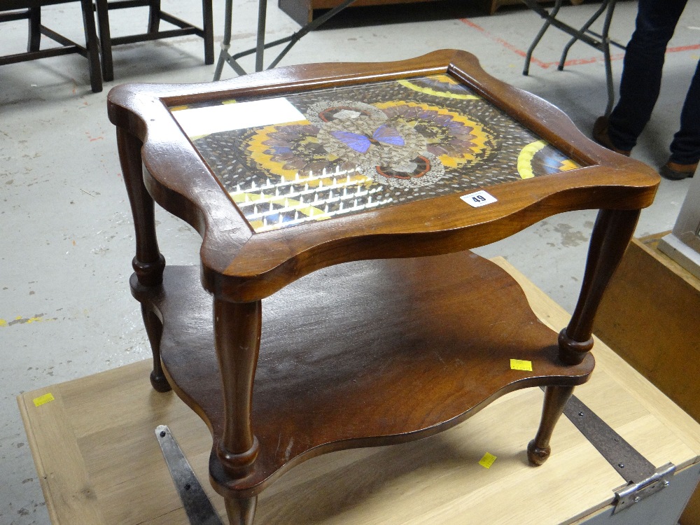 A two-tier vintage Amazonian butterfly table