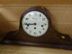 A Bulova Westminster chime mahogany cased oval mantel clock