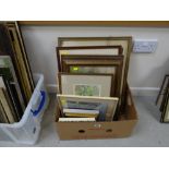 A box of framed pictures