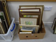 A box of framed pictures