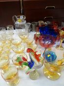 A large quantity of glassware including lemonade set, Murano glass bird and coloured goblets etc