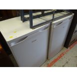 An upright Candy freezer and similar fridge